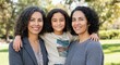 © gn8 - Family connection outdoors with smiling hispanic adult females and child in park setting