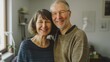 © Mechastock - A retired couple embraces joyfully in their home, showcasing a strong marriage and love after years together