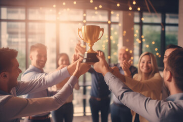business team celebrating gold trophy. concept of success and achievement office team