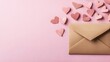 © bvbflo1 - Love letter envelope with paper craft hearts on soft pink background