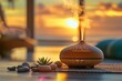 © laperuz - Wooden aroma diffuser with stones and succulent at sunset by the ocean