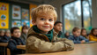 © indah - Preschool boy smiling in classroom, attentive peers, autumn. Educational stock photo