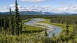 © Mail - Scenic Alaskan Landscape with River, Mountains and Forest Under Cloudy Sky