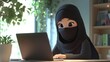 © Fatah - Muslim woman working laptop home office
