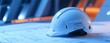 © komwut - A white hard hat and helmet for construction and safety protection