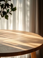 Wall Mural - Sunlight streams across a round wooden table near sheer curtains.