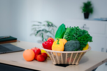 Wall Mural - A vegetable and fruit basket placed on a table, promoting healthy eating, weight loss, and balanced nutrition, representing a natural and fresh lifestyle with no people in the scene