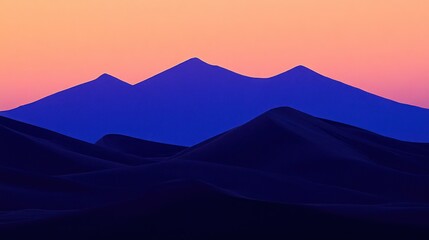 Wall Mural - Silhouette mountains against a vibrant sunset, with a gradient of dark blues and soft pinks.