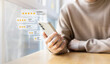 © chinnarach - close up young man and hold smartphone and read review online website page about service and experience with many feedback and ranking score from customer for business quality and evaluation concept