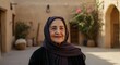 © gn8 - Elderly middle eastern woman in traditional attire with rustic courtyard background