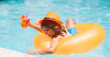 © Volodymyr - Cute little boy in pool on summer day with tropical cocktail. Outdoor summer activity for children. Summer kids vacation. Child floating in pool. Child relaxing in pool, drink summer cocktail.