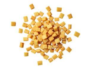 Wall Mural - a scattered arrangement of small, golden-brown, cube-shaped snacks is displayed against a clean whit