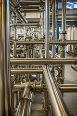 Aufkleber - Complex arrangement of stainless steel pipes in a facility