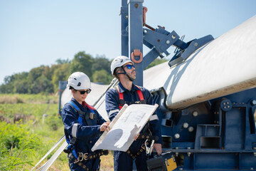 Wall Mural - engineer team working in wind turbine farm. maintenance engineer working in wind turbine.