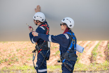 Wall Mural - engineer team working in wind turbine farm. maintenance engineer working in wind turbine.