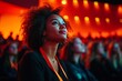 © ChaoticMind - Audience member captivated by presentation in dimly lit auditorium during an engaging event