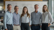 © HavingFunShop - A group of four architects, two men and two women, dressed in smart-casual attire, standing in a modern office with large blueprint designs visible in the blurred background.