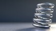 © nabila - Metallic Spring on Gray Surface with Soft Lighting Highlights