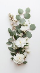 Canvas Print - A beautiful bouquet of white flowers and green leaves is arranged in a way that creates a sense of harmony and balance. The white flowers are the main focus of the arrangement