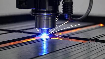 Aufkleber - Laser cutting machine creates precise shapes using intense light and heat in a manufacturing workshop