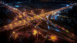 © suriyapong - Beautiful top view of car traffic at roundabout lane and buildings. 4K drone, Urban cityscape concept or abstract of advanced innovation, financial technology, energy power, expressway