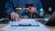 © Mdisk - Market Analysis and Trading Insights, Trader analyzes graphs and data on digital devices, modern financial technology for market evaluation and decision-making in dynamic environment