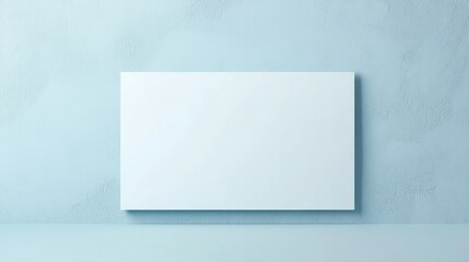 Wall Mural - horizontal poster mockup with clean white surface against a calming light blue wall ideal for design