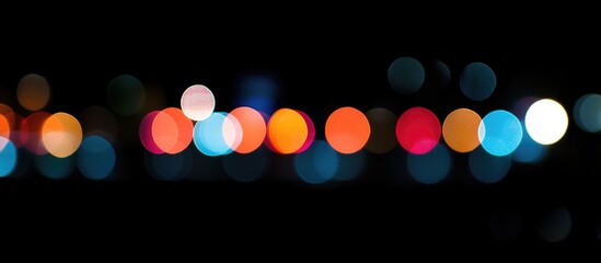 Wall Mural - vibrant bokeh lights creating a colorful abstract background in various shades of orange blue and wh