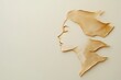 © Liza - Abstract paper cut-out art of a woman's profile with flowing hair