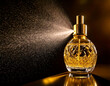 © Jakob - A bottle of perfume is spraying out of a spray bottle. The bottle is gold and has a diamond pattern on it