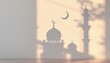 © Mahfuz - A serene image showcasing the shadow of a mosque and crescent moon on a light beige wall