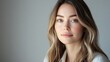 © ASA Creative - A close-up portrait of a beautiful young woman with brunette blonde ombre hair, and a serene expression, showcasing natural beauty and elegance and tranquility, professional studio portrait photograph