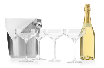 Bottle of champagne, empty glasses and ice bucket isolated on white