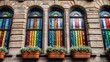 © sembiz sembiz - historic building facade with stained glass windows shimmering in rainbow colors and flower pots below for use in architectural and artistic compositions