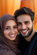 © Evon J - World Hijab Day Happy young middle-eastern couple smiling outdoors with pumpkins in the background