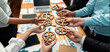 © InfiniteFlow - Group of multiracial business people joining gear wheels together over table as effective unity and productive teamwork concept. Efficient system business team process for solution solving. Meticulous