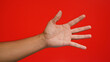 © Krakenimages.com - Manâ€™s open hand extends against a vibrant red background, illustrating gesture and expression in a colorful, striking visual.