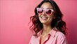 © miss irine - Young woman smiles brightly at camera wearing pink sunglasses, pink shirt against solid pink background. Stylish portrait beauty, confidence. Joyful expression, vibrant colors create happy mood.