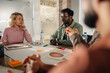 © Zamrznuti tonovi - Marketing team discussing new project during a meeting in the office