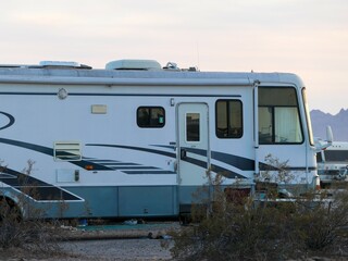 old a-class rv stealth camping in the desert