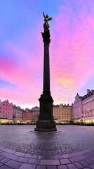 Wall Mural - Majestic Column Stands Tall in City Square at Sunset with Vibrant Pink and Purple Sky