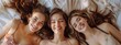© Fox - In the scene, three young women with long hair and casual attire are joyfully relaxing on a bed, showing affection and forming a strong bond of friendship, radiating happiness and positivity