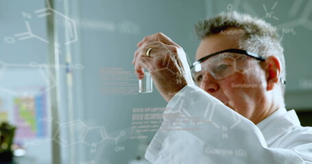 Canvas Print - image of data processing and chemical formula over caucasian male scientist doing experiment