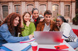 © Jose Calsina - Enthusiastic Students Collaborating on a Laptop While Studying Together and Sharing Ideas in a Bright and Engaging Learning Environment Surrounded by Friends and Classmates at Their University Campus
