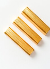 Leinwandbilder - Three golden bars on white background.
