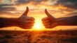 © EEKONG - Hands Giving Thumbs Up Gesture Against Beautiful Sunset Background