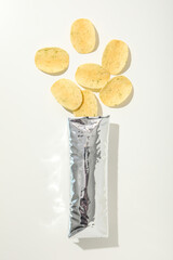 Wall Mural - Potato chips with a shiny silver pack