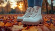 © Monika - Stylish White Lace-Up Boots in Vibrant Autumn Leaves