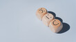 © LAONG - Wood cube with smile and sad icon, World mental health day or feedback rating concept, Positive customer review, Wood cube stacking with emotion face icon on pastel blue background