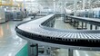 © mila103 - A conveyor belt in a factory with a lot of machinery
